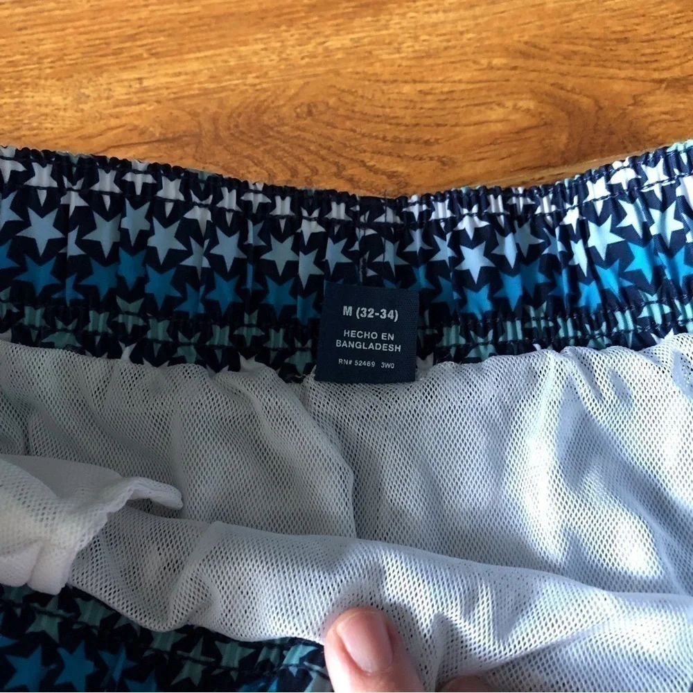 George blue striped star pattern swim trunks in size M (32-34)